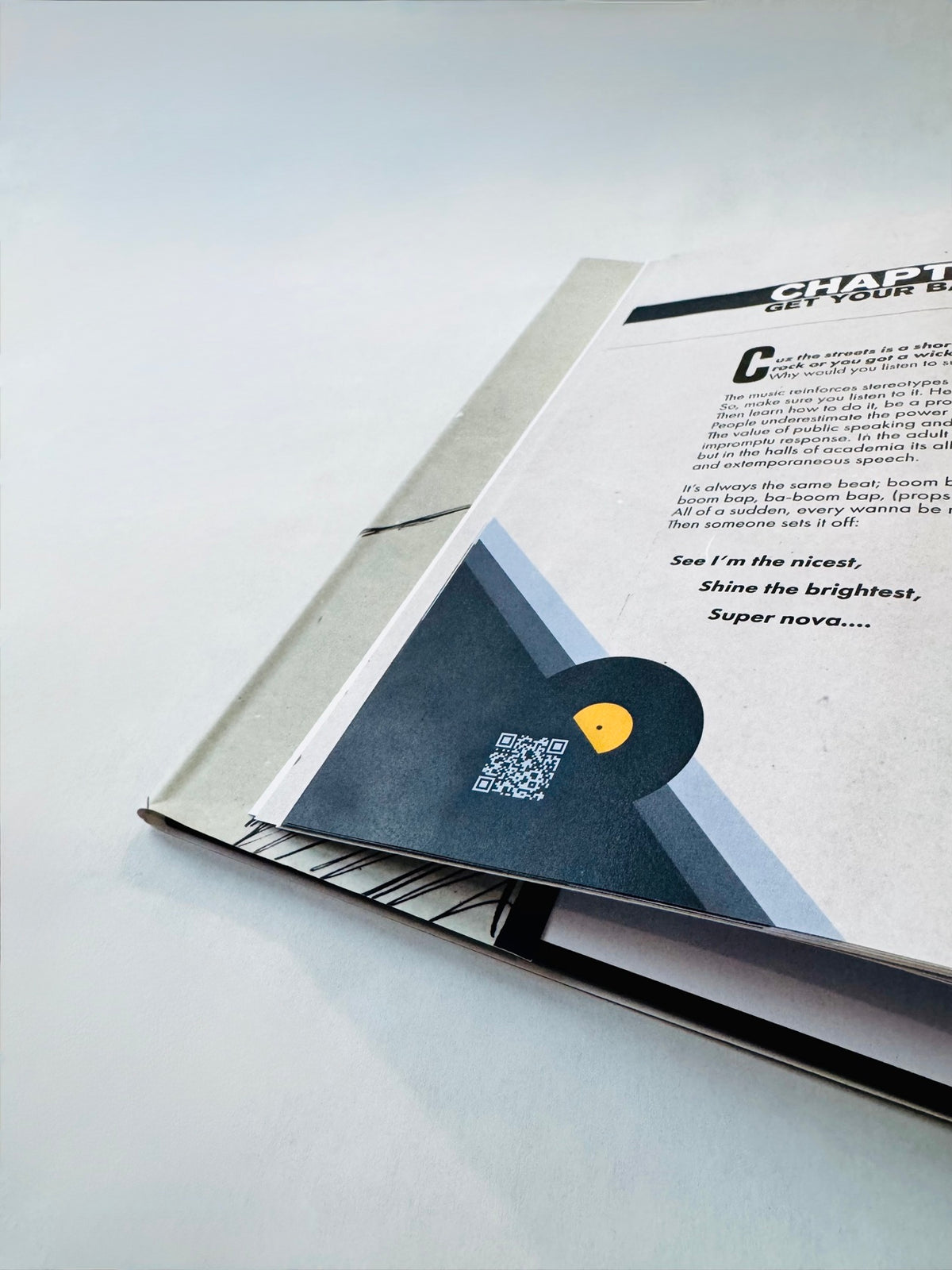 QR code inside the vinyl graphic — scan to hear the chapter's music